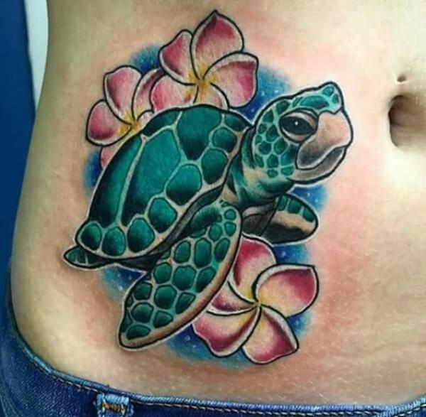 Green turtle with plumeria tattoo