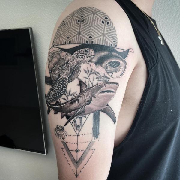 Realistic ray turtle and shark against geometric pattern half sleeve tattoo