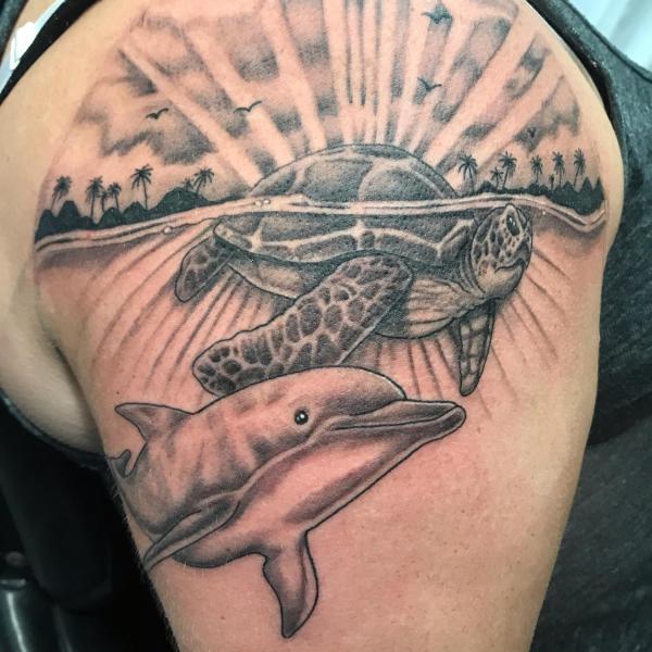 Sea turtle and dolphin tattoo black and grey