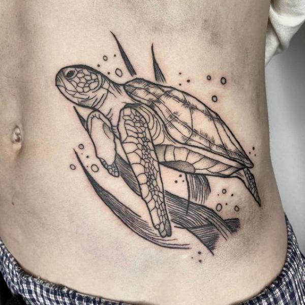 Sketchy turtle side tattoo