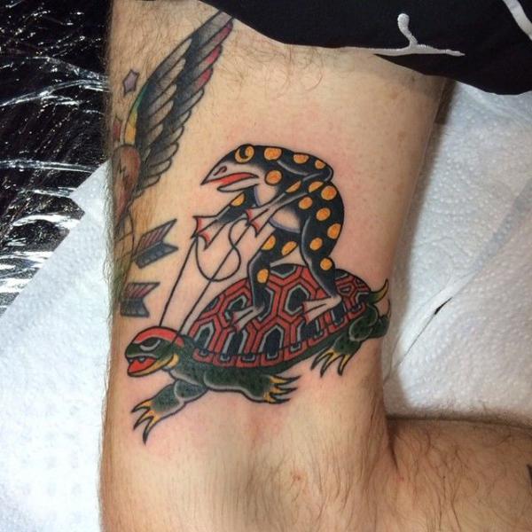 Traditional frog riding turtle tattoo