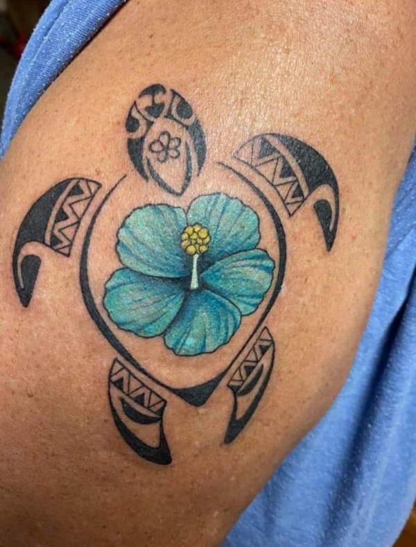 Tribal turtle with blue hibiscus tattoo