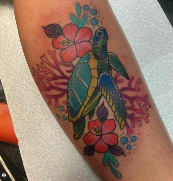 Turtle with hibiscus flower tattoo