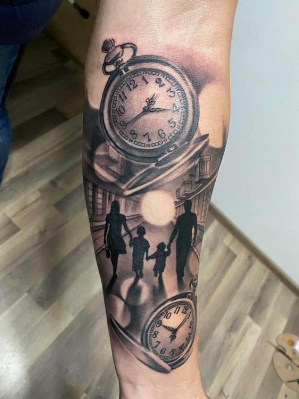 Black and grey pocket watches and family on street tattoo