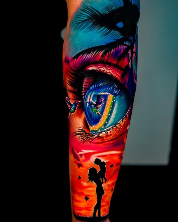 Family and eye with birds tattoo