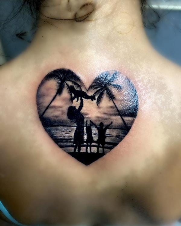 Family at beach heart back tattoo