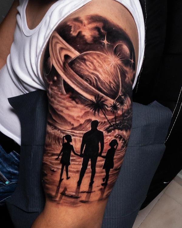 Father and daughters with celestial and beach tattoo