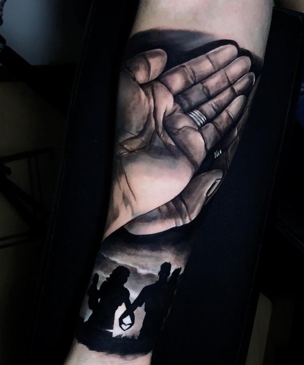 Hand and family tattoo