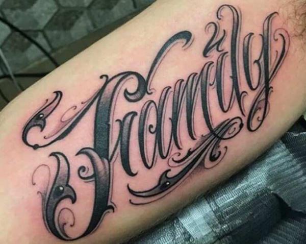 Swirling family font tattoo