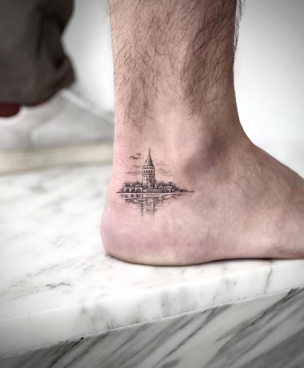 Miniature tattoo of Galata tower, Istanbul on ankle