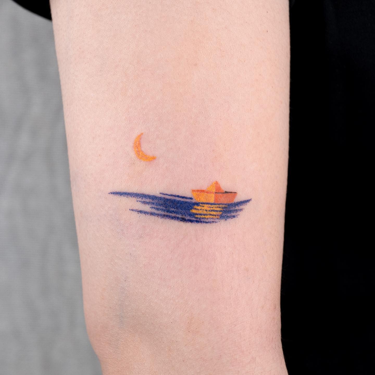 Minimalist tattoo of crescent moon and boat tattoo