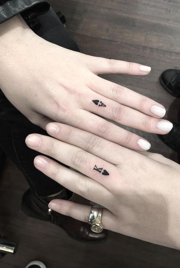Poker letters matching tattoos for couples on their fingers