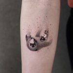 a small, adorable Patrick Star tattoo on the forearm