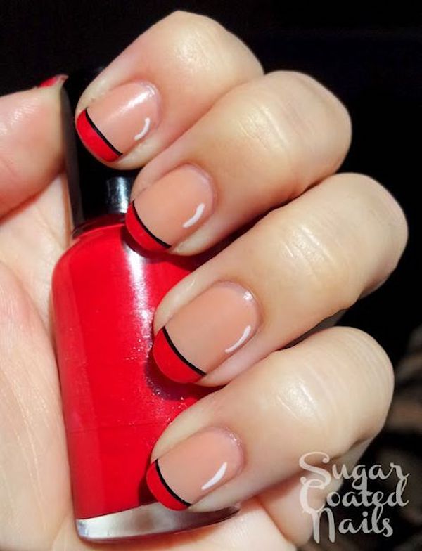 Black and red nail tips on flesh-colored cuticles 