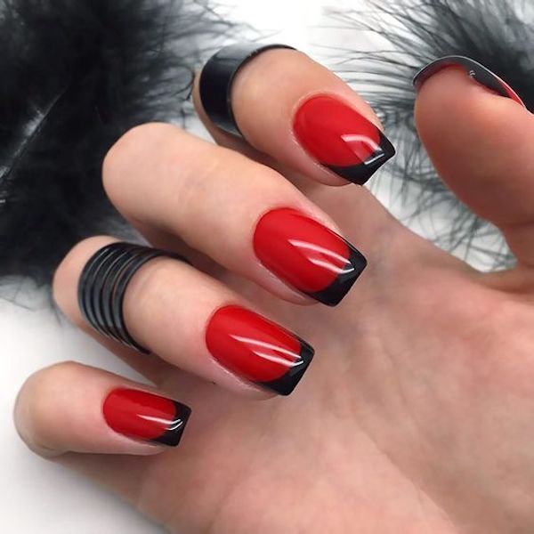 French nails with a crimson background and black tips. 