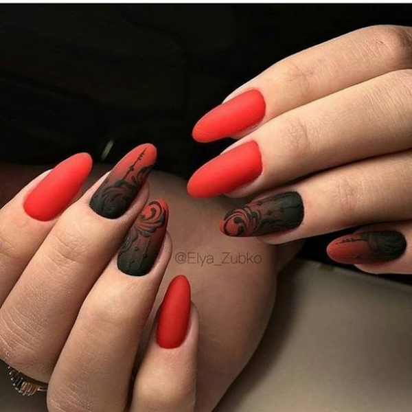 Almond-shaped red manicures with a black gradient lace