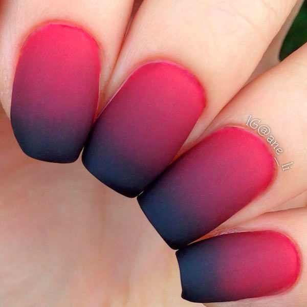 nails with gradients of black to red from tip to nail bed 