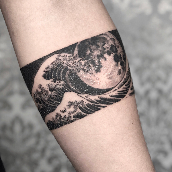 Armband tattoo with black and white waves