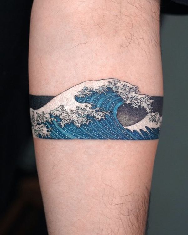 Armband tattoo with white and blue waves