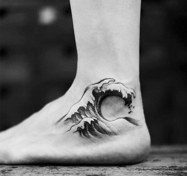 Black and white wave ankle tattoo