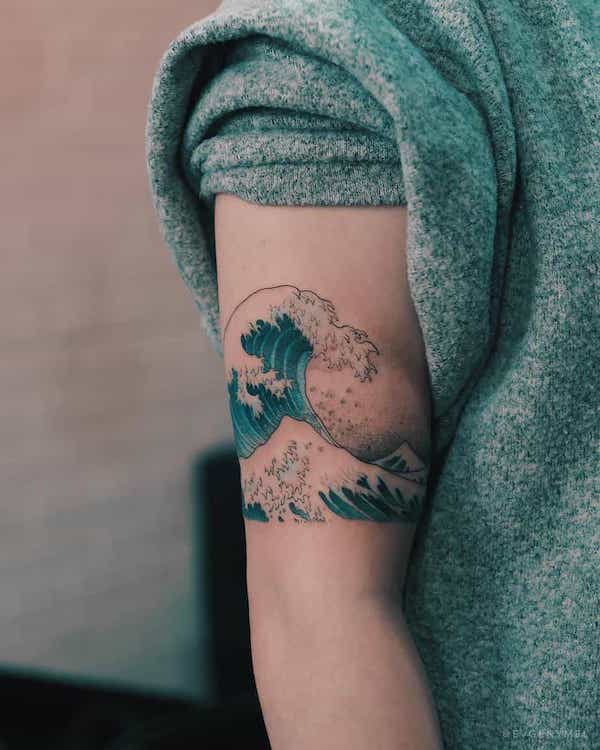Colorful sleeve tattoo with Great Wave