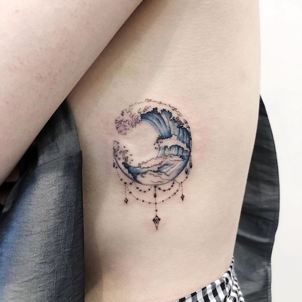 Cute wave rib tattoo with pendants