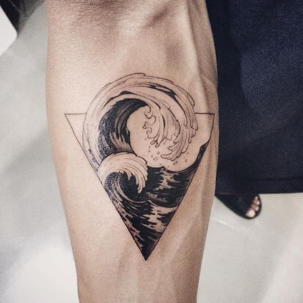 Forearm tattoo of Great Wave in black and white style