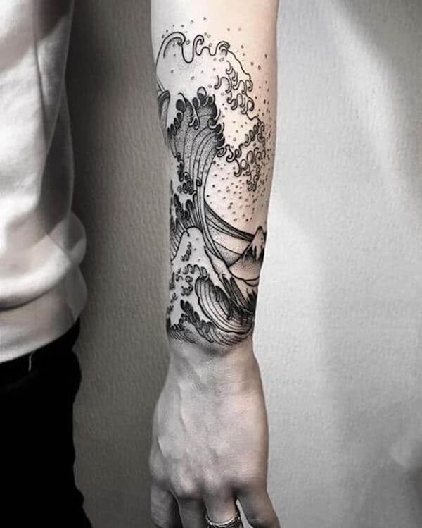 Forearm tattoo with a monochrome wave