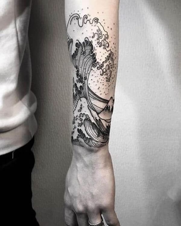 Forearm tattoo with a monochrome wave Forearm tattoo with a monochrome wave