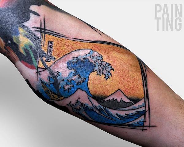 Great Wave painting tattoo on forearm