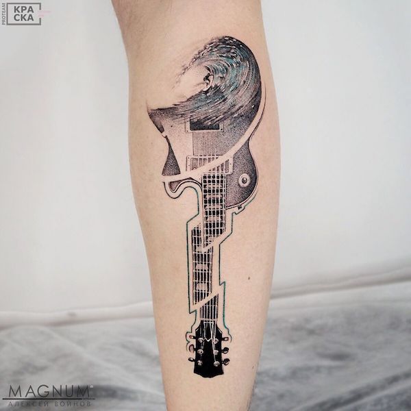 Guitar tattoo with one end melting into waves
