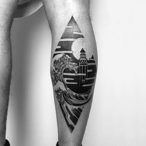 Lighthouse and wave at night forearm tattoo