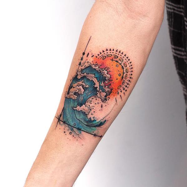 Massive wave under the sun forearm tattoo