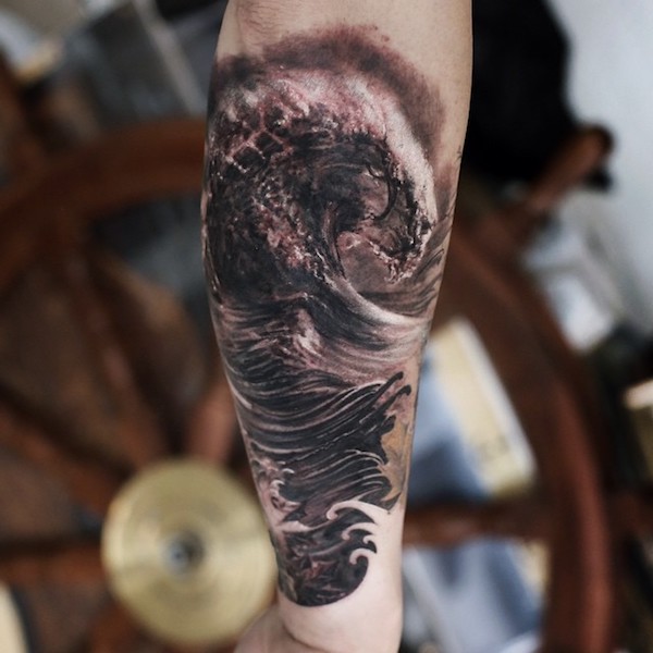 Powerful wave tattoo on calf in realistic style