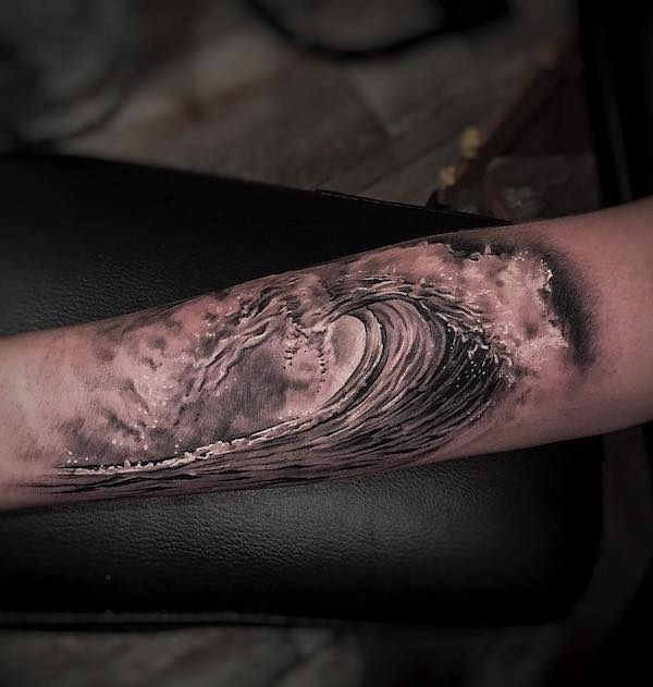 Realistic wave forearm tattoo