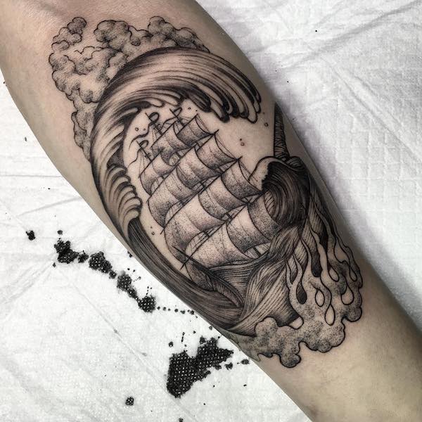 Sailboat tattoo in the waves