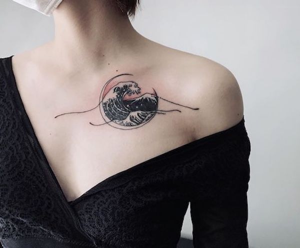 Small wave chest tattoo female