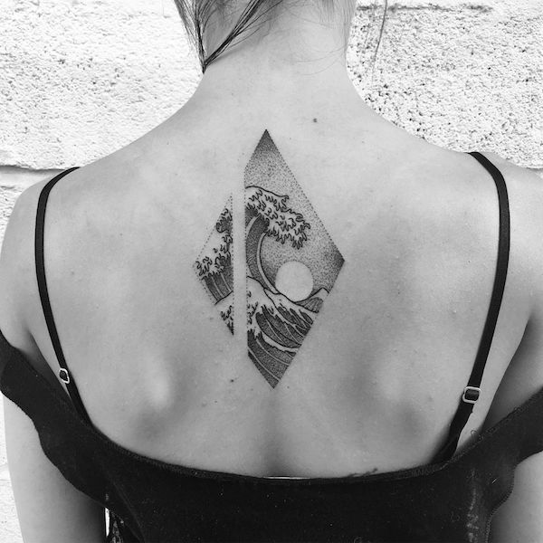 Small wave tattoo on back female