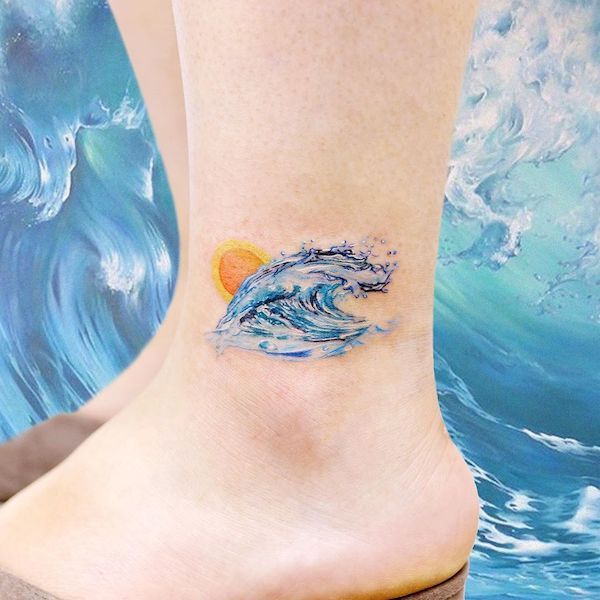 Watercolor wave and sun tattoo on ankle Watercolor wave and sun tattoo on ankle