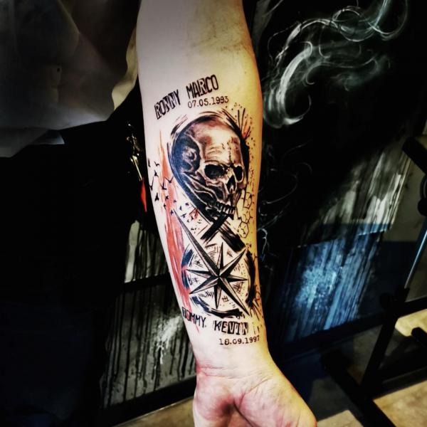 Compass and skull infinity forearm tattoo