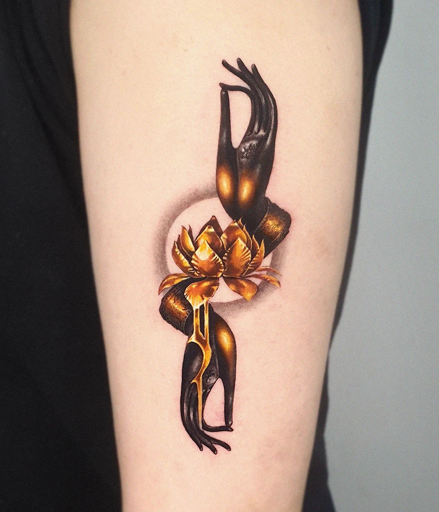 Golden lotus and finger gesture