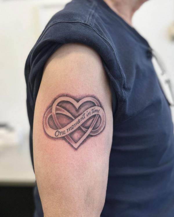 Heart and infinity symbol with phrase One moment in time