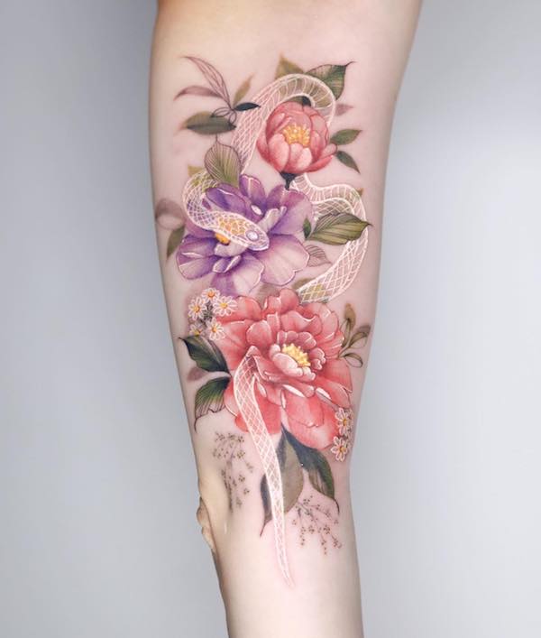 Snake intertwined with flowers tattoo female Snake intertwined with flowers tattoo female