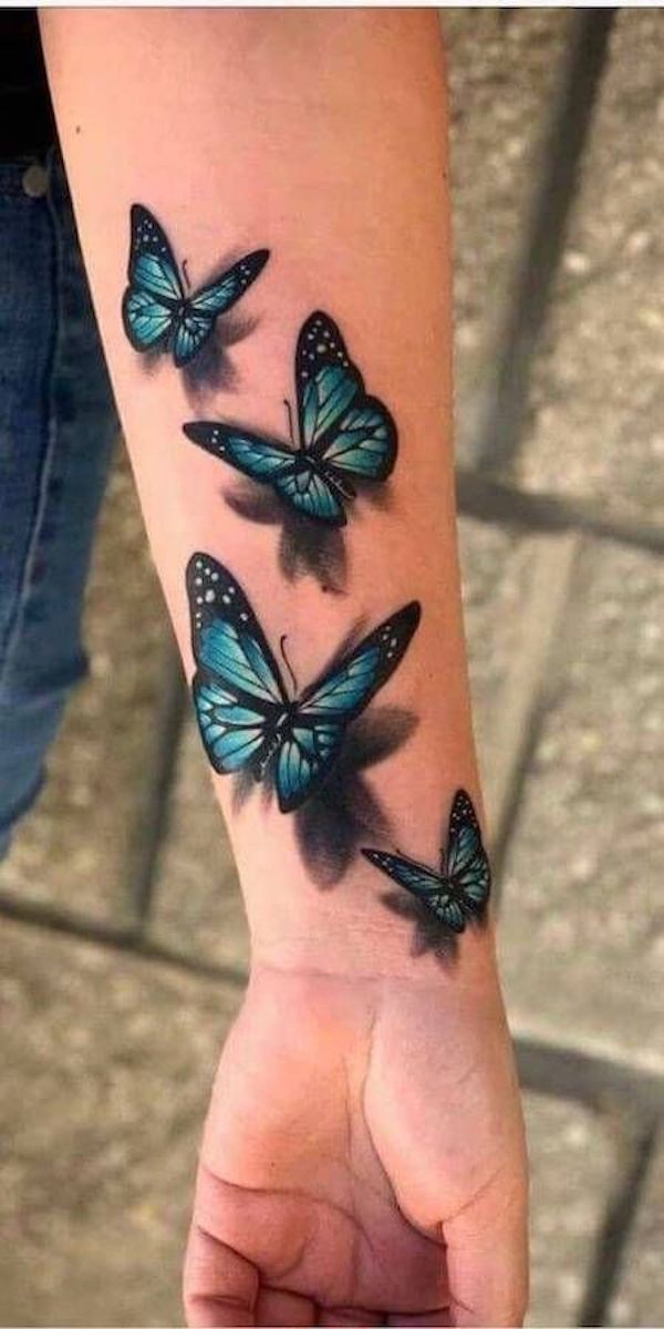 Four blue monarch butterflies forearm 3D tattoo