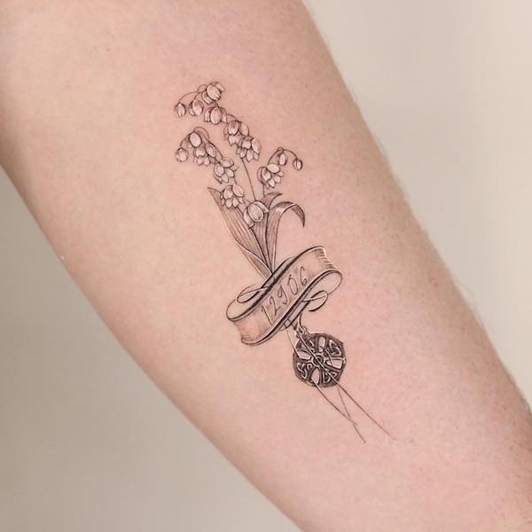 A bouquet of lily of the valley with ribbon