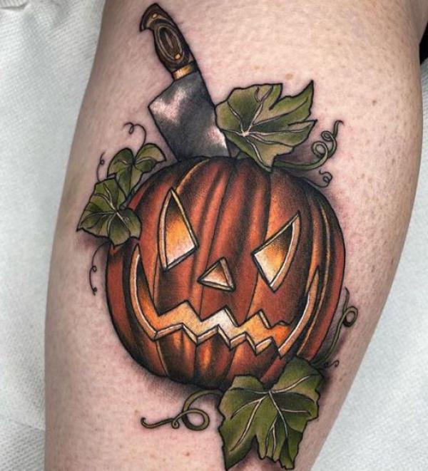 A knife pierced the carved pumpkin