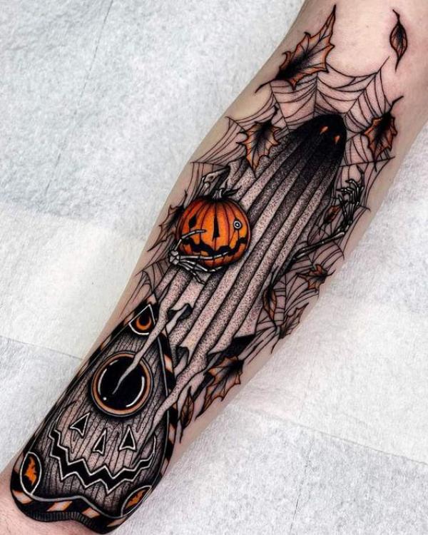 A pumpkin suck in a hole of spider web