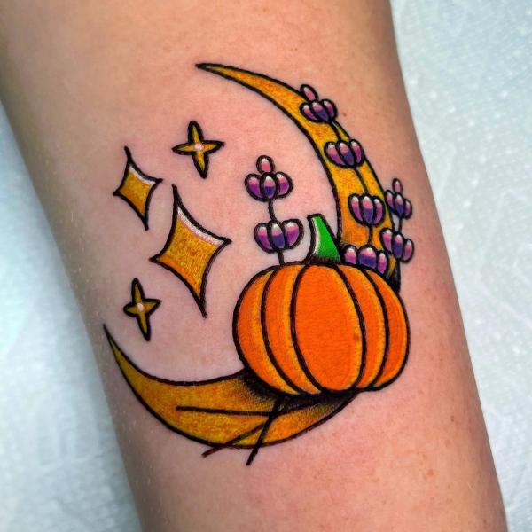 A pumpkin with stylized crescent moon and stars