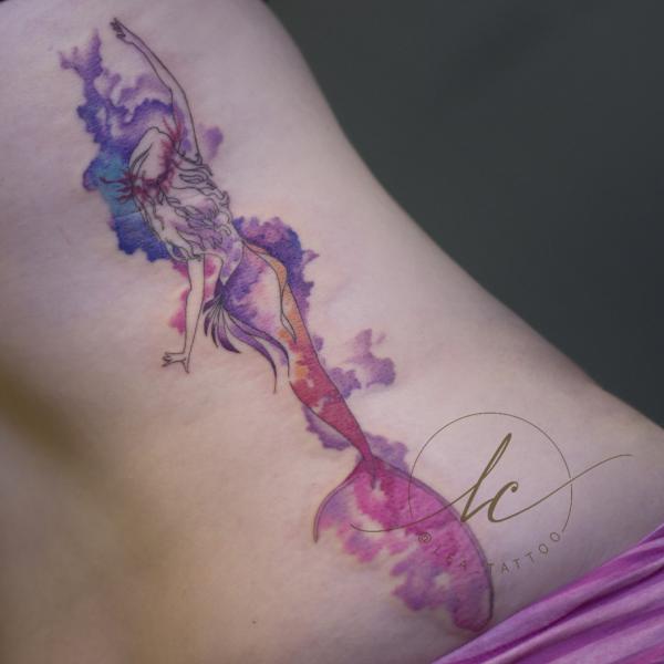 Abstract mermaids tattoo in watercolor style