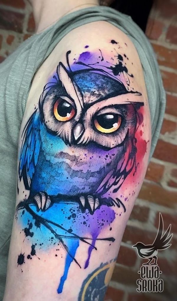 An artistic owl with watercolor splatters